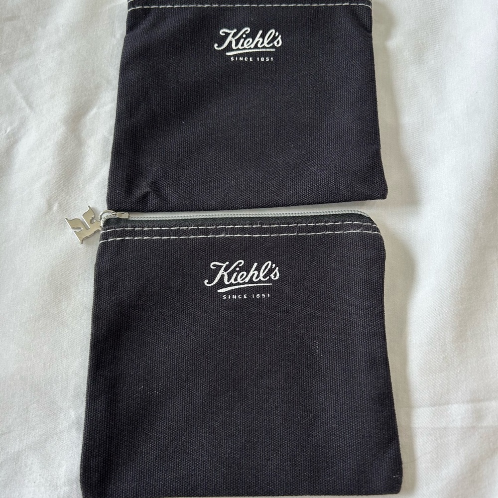 Kiehl's cosmetic small bag / pouch with a zipper closure and white stitching.